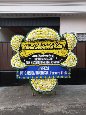 Papan Bunga Duka di Ujung