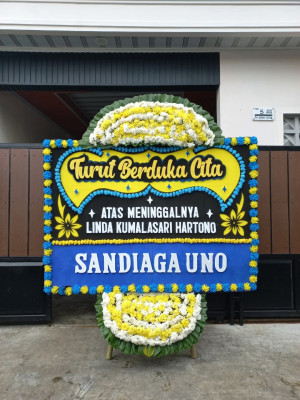 Papan Bunga Duka di Ujung